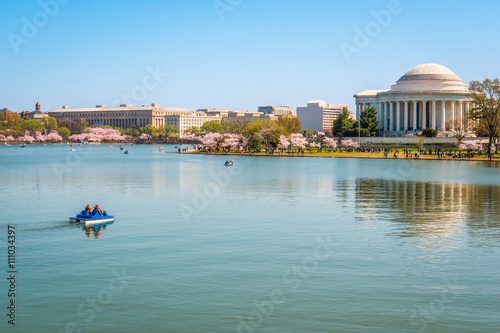 Wide angle travel view of Washington DC boating on Potomac River near Jefferson Memorial