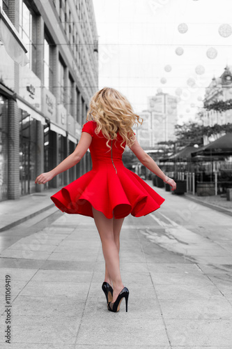Woman in red dress walking at BW outdoor