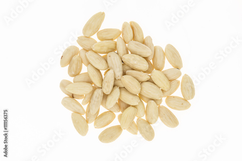 Heap of blanched almonds, on white background