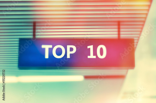 Word TOP 10 on advertising board with shiny bright colors