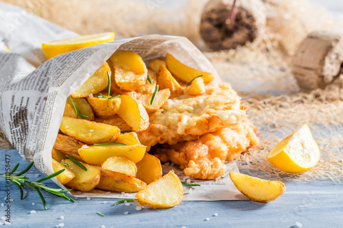 Closeup of delicious fish cod with chips with lemon