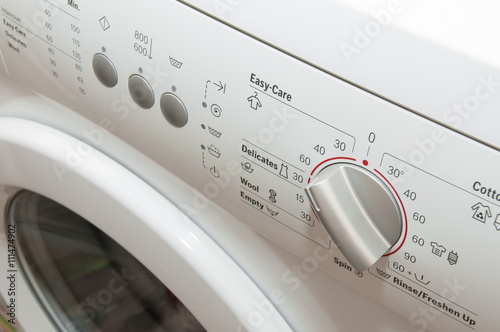 Washing machine controls. Temperature control on washing machine. Close up of a washing machine control panel.