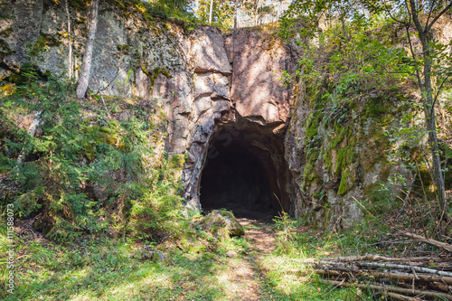 Entrance to dark cave in rock