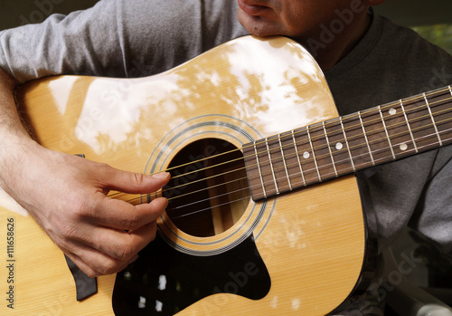 Man playing acoustic guitar