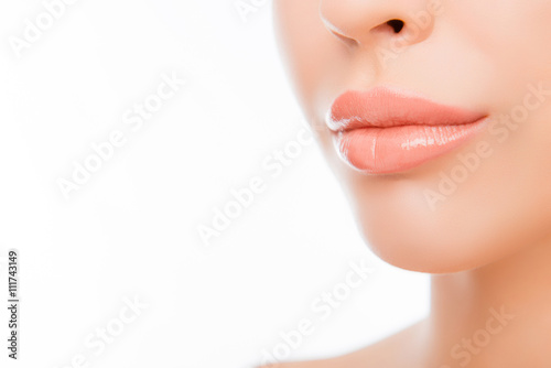 Close-up woman's lips with natural make up on white background