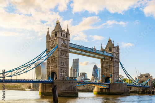 Tower Bridge in London during sunset with London’s financial district at the background