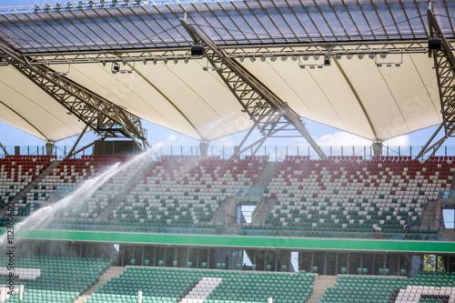 Watering grass on big sport stadium