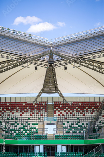 Stadium. Roof over colorful tribunes.