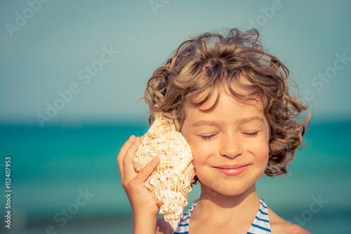 Child relaxing on the beach