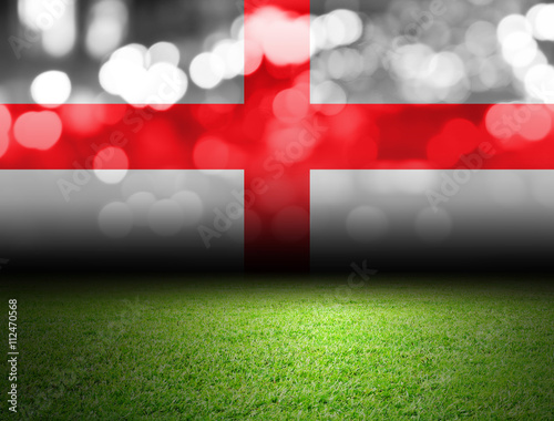 Soccer field and bokeh with england flag