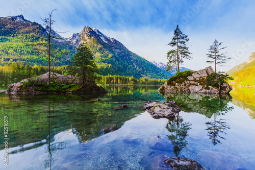Lake Hintersee with blue sky and clouds in spring.