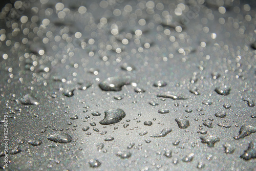Water drops on metal surface. Selective focus.