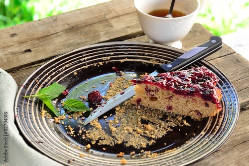 last piece of cherry pie with jam on a plate