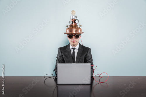 Vintage businessman sitting at office desk