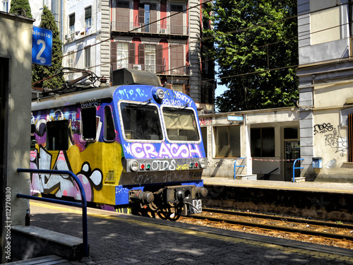 smeared train with graffiti