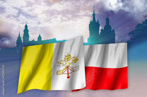 Flags of Poland and Vatican over Cracow landscape