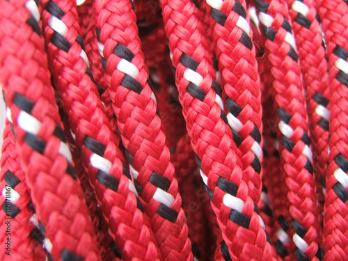 Close up of new red rope - photo taken of marine rope on a sailboat.