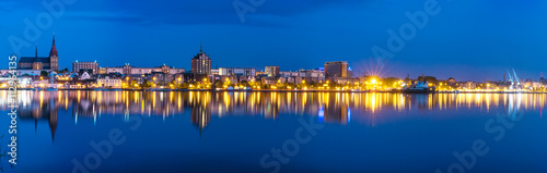 Night Panorama view to Rostock. River Warnow and City port.