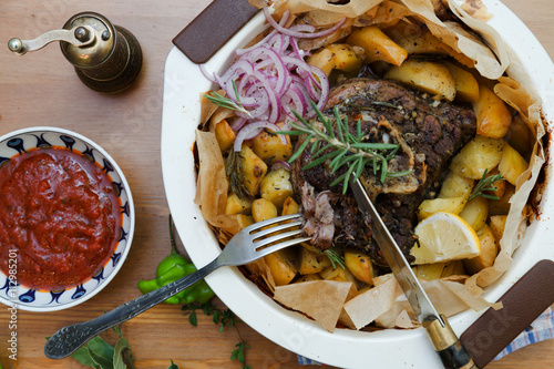 Kleftiko - slowly cooked lamb with vegetables and feta cheese. Greek dish.
