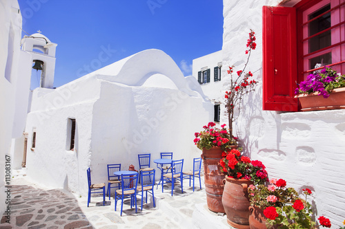 Traditional greek street with flowers in Amorgos island, Greece