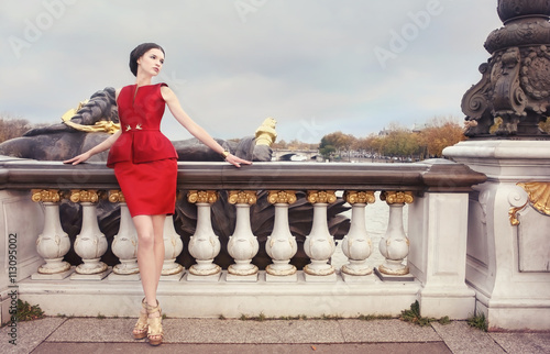 Woman in red dress, on Alexandre Bridge, Paris, France
