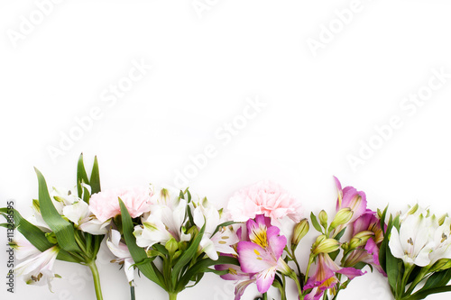 Pink gillyflowers with alstroemeria on white background