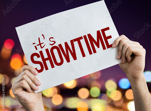 Its Showtime placard with night lights on background