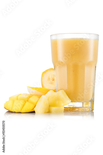Yellow smoothie with mango, pineapple, banana and melon in glass