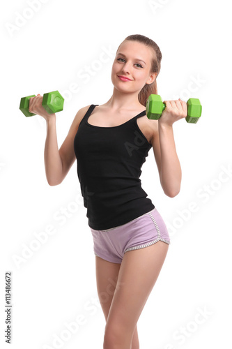 Young sporty girl with dumbbells