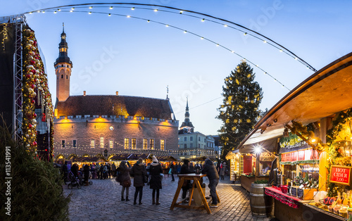 Traditional Christmas market in Tallinn old town. HDR image. Long time exposure with motion blur.