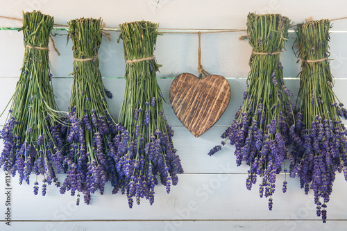 Lavender and wooden heart on the background of the old boards 