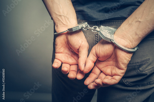 male hands in handcuffs