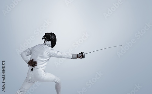 Composite image of man wearing fencing suit practicing with sword