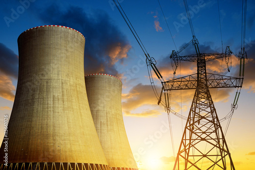 Nuclear power plant with high voltage tower at sunset