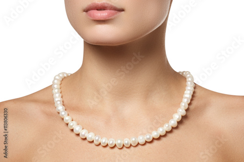 Beautiful fashion pearls necklace on the neck. Jewellery and bijouterie