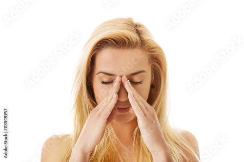 Woman with sinus pressure pain.