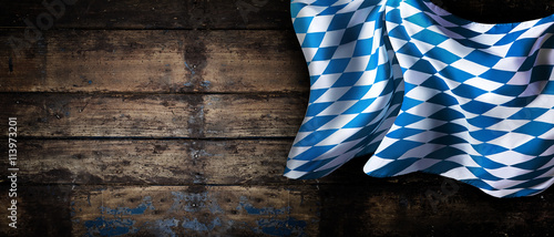 Bavarian flag over an old wooden wall banner