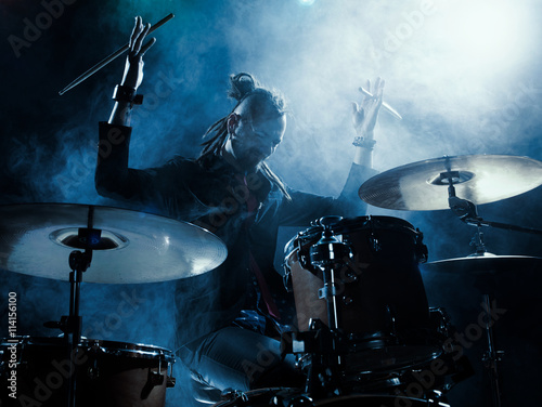 Silhouette of the drummer on stage.