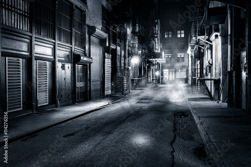 Moody monochrome view of Cortlandt Alley by night, in Chinatown, New York City