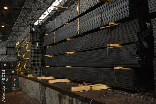 Steel tube. Rectangular steel pipe. Metal pipe. Steel rolled bar. Stuck of steel pipes. Steel pipe bundle in industrial warehouse.