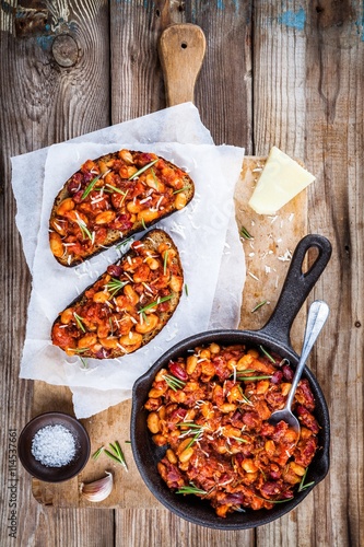 baked beans with rosemary and parmesan on toast
