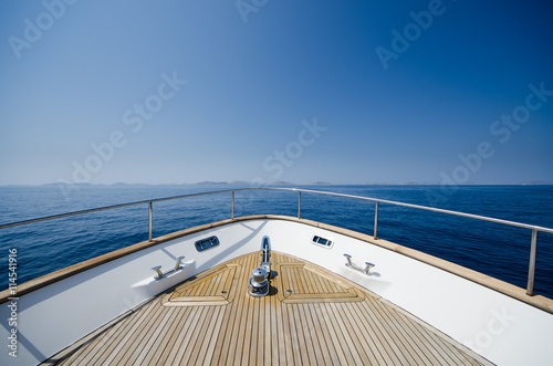 Wide angle shot of front of the yacht in summer time