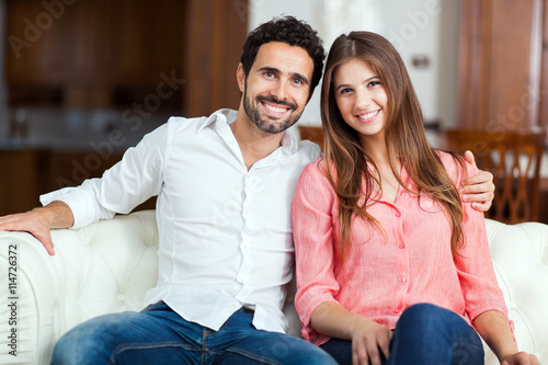 Young couple on the sofa in love