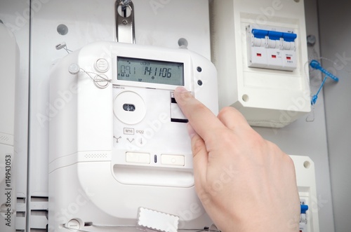 Electric energy meter. Electrical technician servicing unit