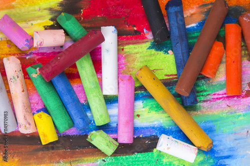 oil pastels crayons on colorful background 