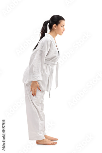 Female martial artist bowing