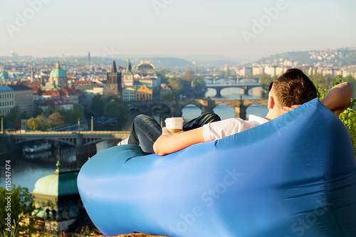 man relaxing in an inflatable sofa