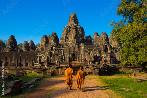 The monks in the ancient stone faces of Bayon temple