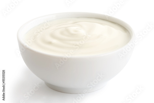 Ceramic bowl of white yoghurt isolated on white background.