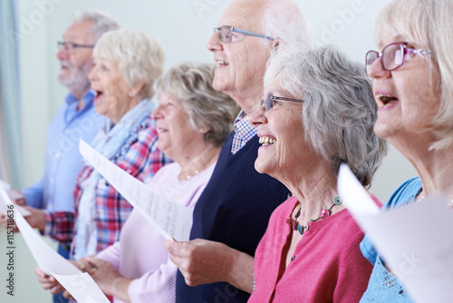 Group Of Seniors Singing In Choir Together